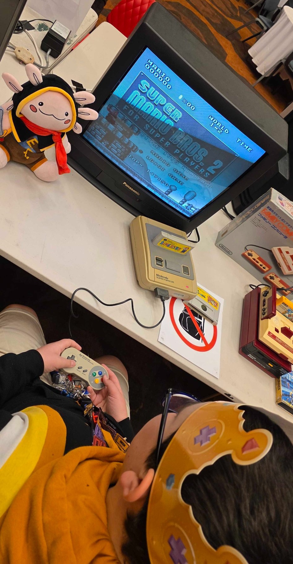 Blake playing Super Mario Bros 2 in the Classic Gaming Room