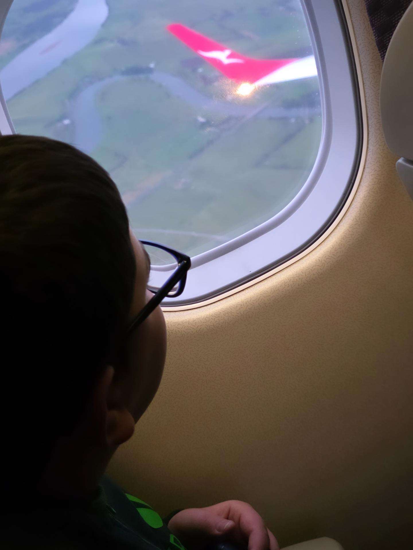 Blake looking out of the aircraft window on the way to Melbourne